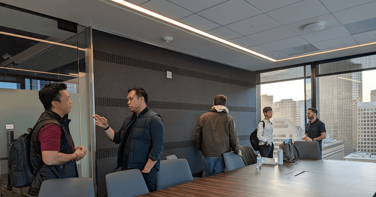 FounderNexus members talking in small groups after a speaker event